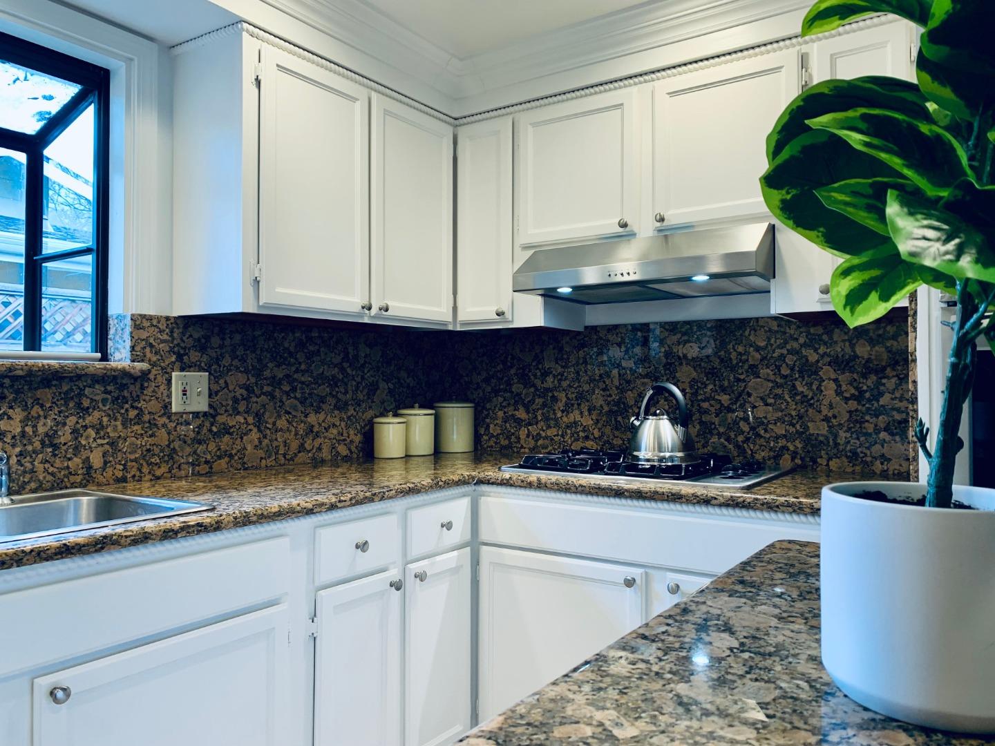 2432 Rinconada Drive San Jose, CA 95125 - Photo 5 of 33 a kitchen with a sink and cabinets