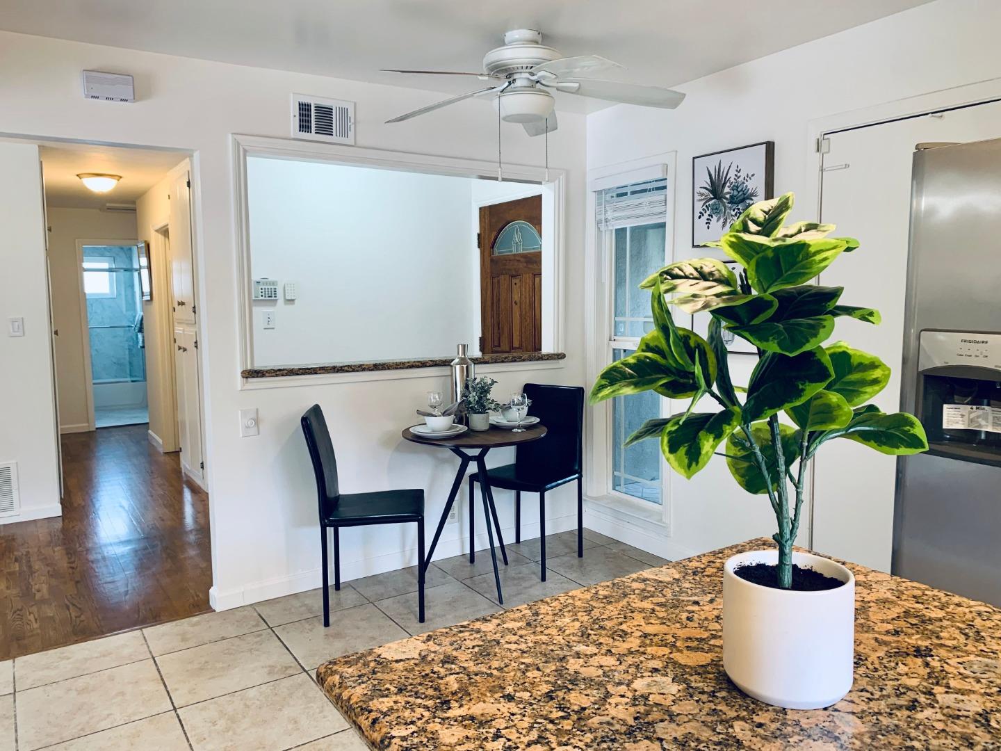 2432 Rinconada Drive San Jose, CA 95125 - Photo 7 of 33 a dining room with furniture and a potted plant