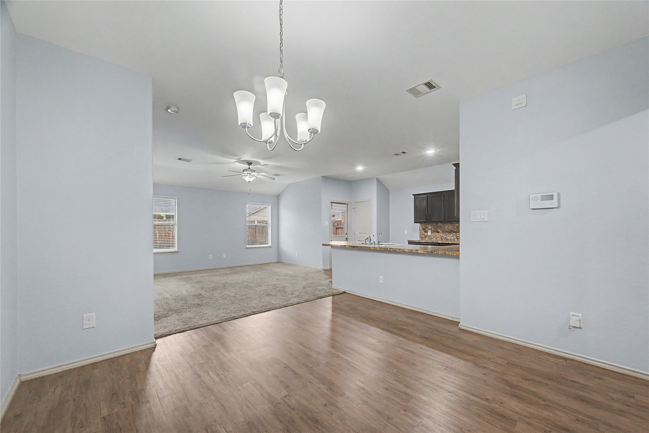 16430 Rodeo River Road Houston, TX 77049 - Photo 16 of 34 a view of a kitchen with a sink and dishwasher wooden floor