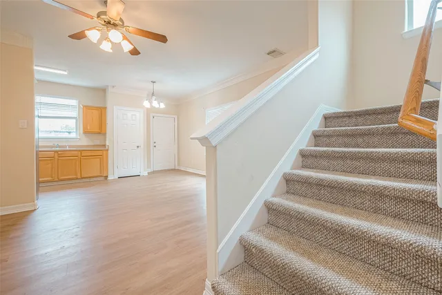 a view of an entryway with wooden floor