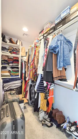 a bathroom with a double vanity sink toilet and a tub