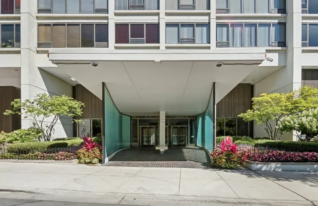 a front view of a building with flowers