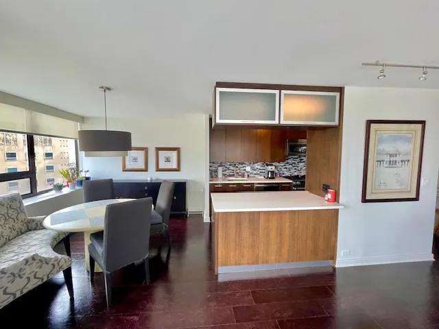 a living room with kitchen island furniture and a window
