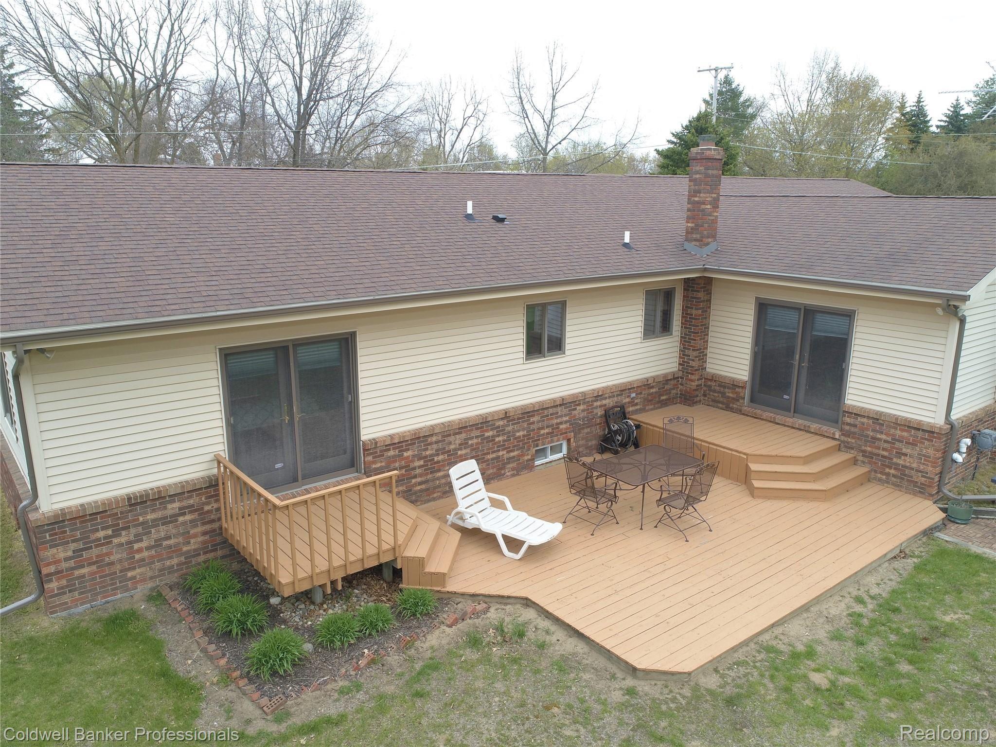 1191 West Sutton Road Metamora, MI 48455 - Photo 15 of 63 deck and back of house.JPG