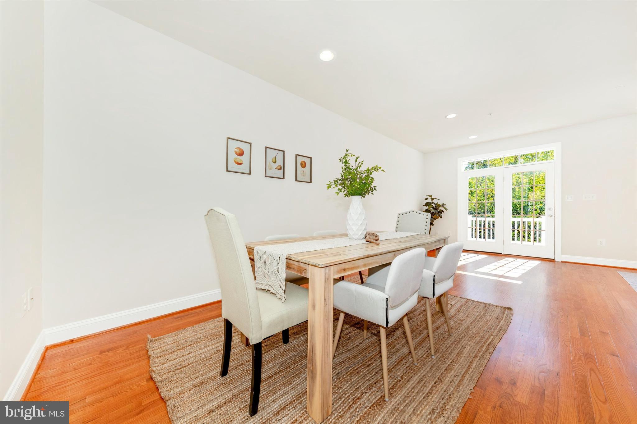 9655 Bothwell Lane Frederick, MD 21704 - Photo 20 of 58 a dining room with furniture and wooden floor