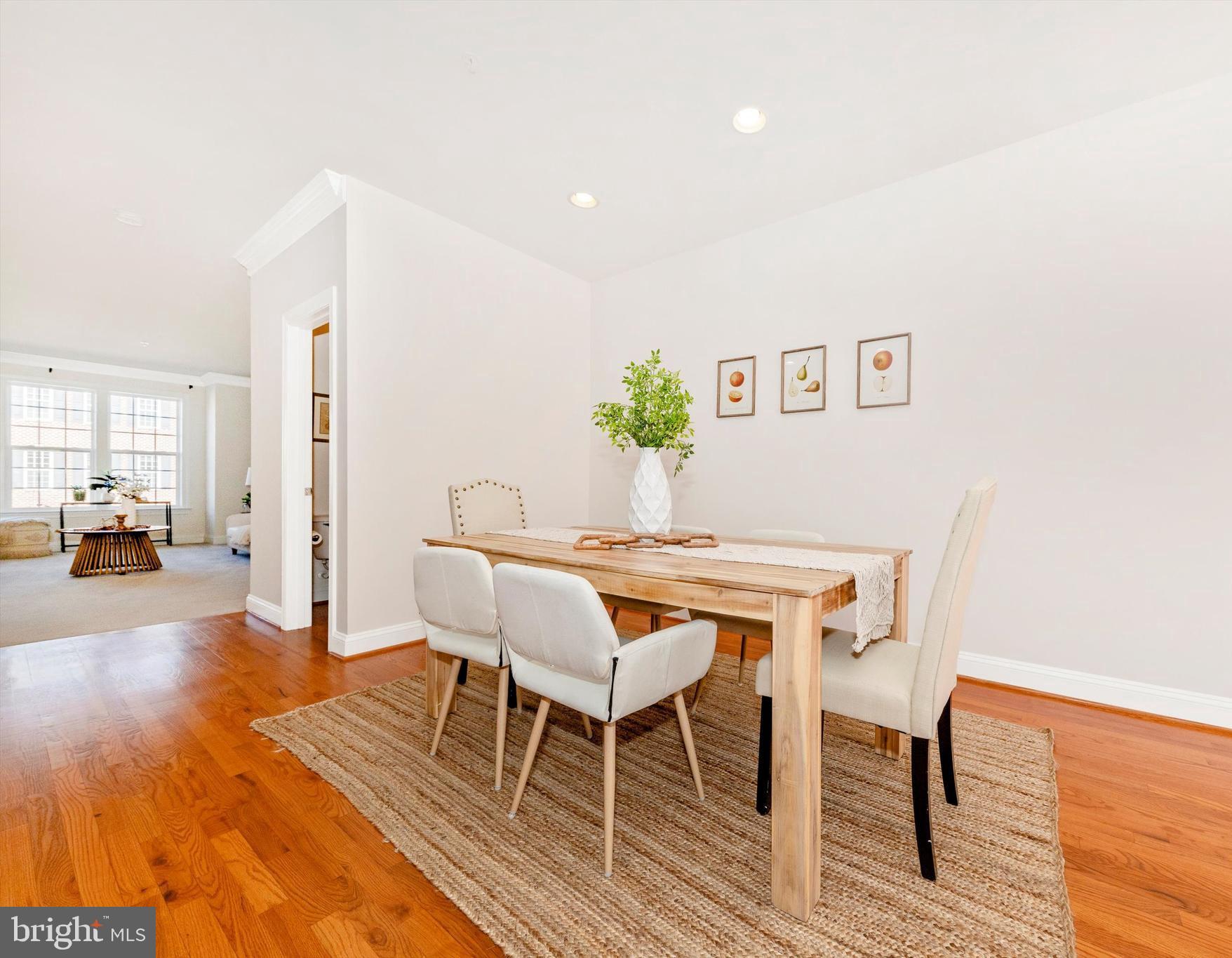 9655 Bothwell Lane Frederick, MD 21704 - Photo 21 of 58 a view of a dining room with furniture and wooden floor