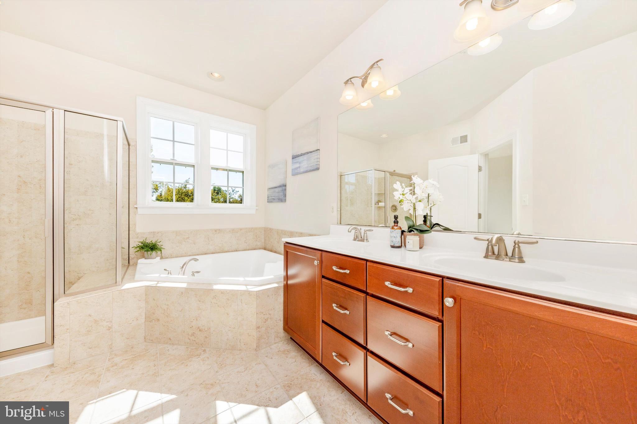 9655 Bothwell Lane Frederick, MD 21704 - Photo 31 of 58 a bath room with a sink double vanity and a bathtub
