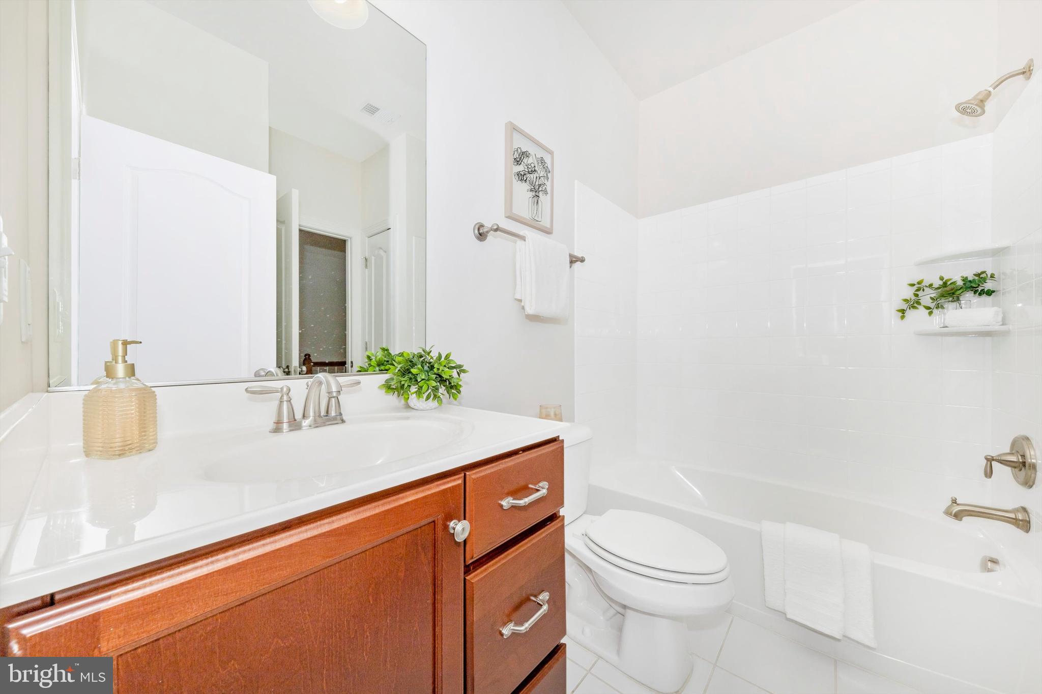 9655 Bothwell Lane Frederick, MD 21704 - Photo 37 of 58 a bathroom with a sink a toilet and shower