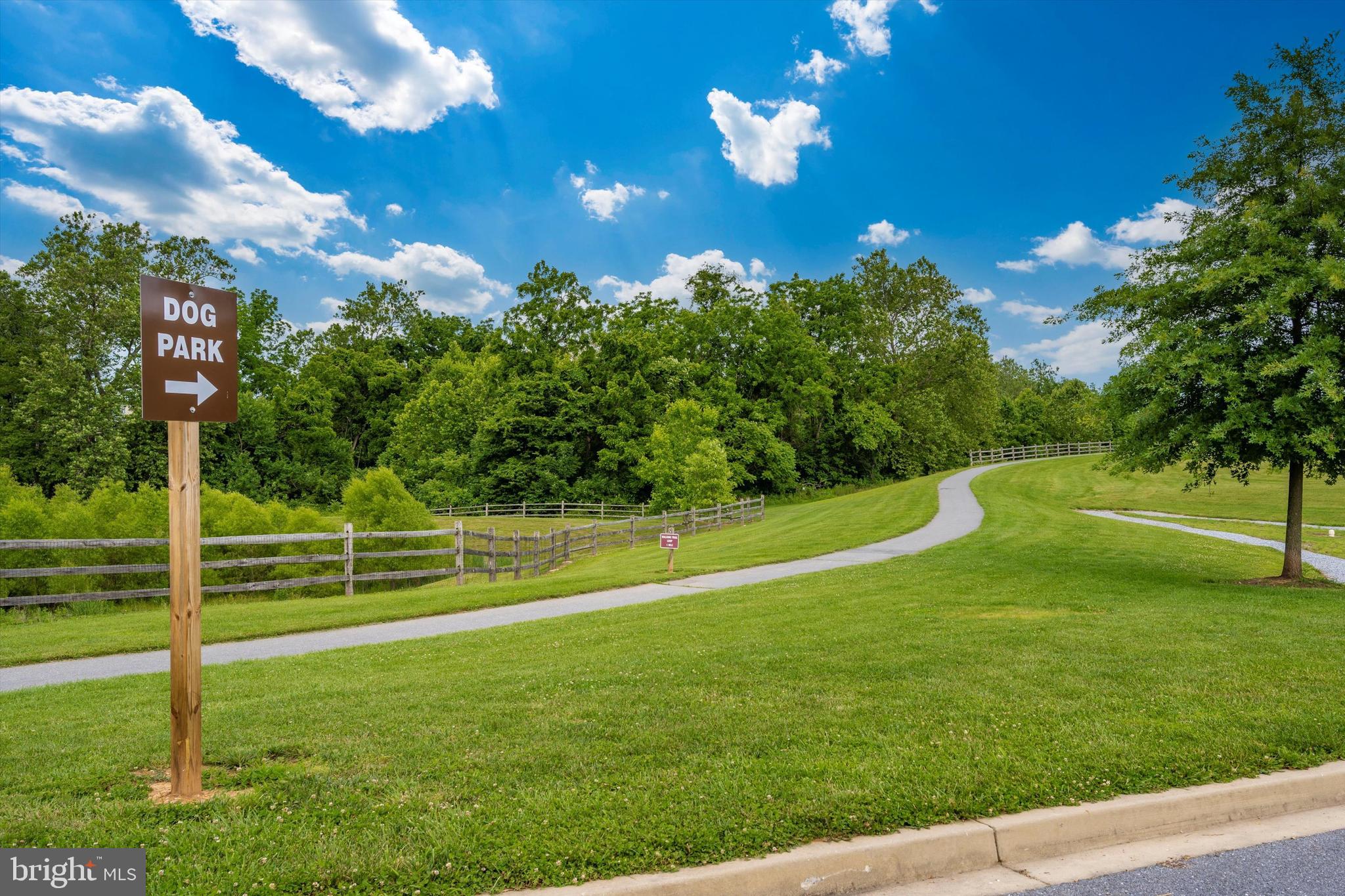 9655 Bothwell Lane Frederick, MD 21704 - Photo 46 of 58 a view of a golf course with a lake