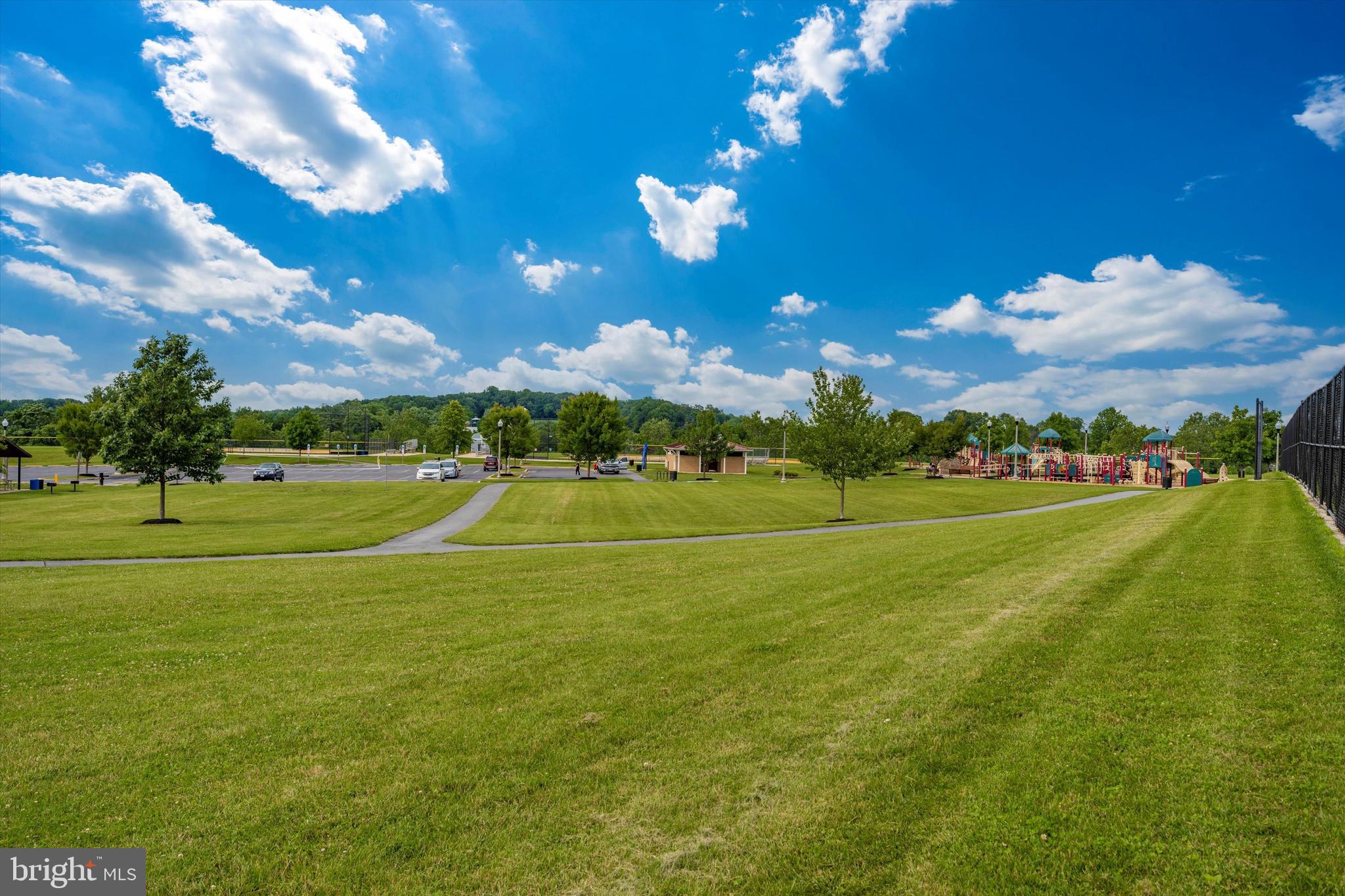 9655 Bothwell Lane Frederick, MD 21704 - Photo 47 of 58 a view of a golf course with a lake