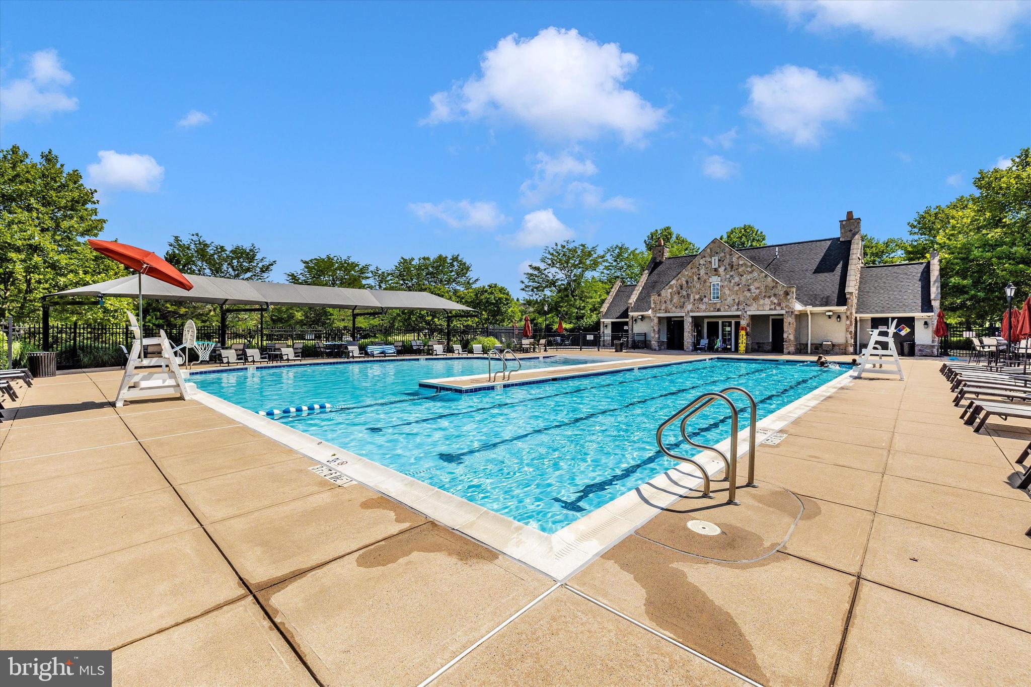 9655 Bothwell Lane Frederick, MD 21704 - Photo 53 of 58 a view of swimming pool with outdoor seating and trees in the background