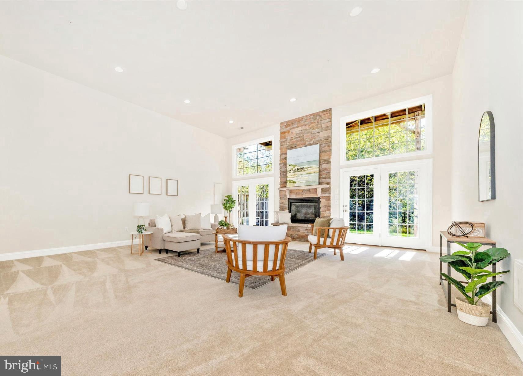 9655 Bothwell Lane Frederick, MD 21704 - Photo 9 of 58 a living room with furniture and floor to ceiling windows
