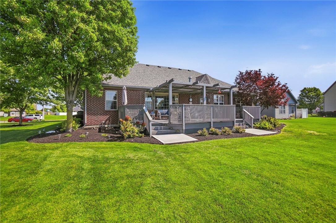 710 Governors Road Troy, OH 45373 - Photo 51 of 56 This outdoor space features an expansive deck with a pergola, perfect for relaxation and entertaining.