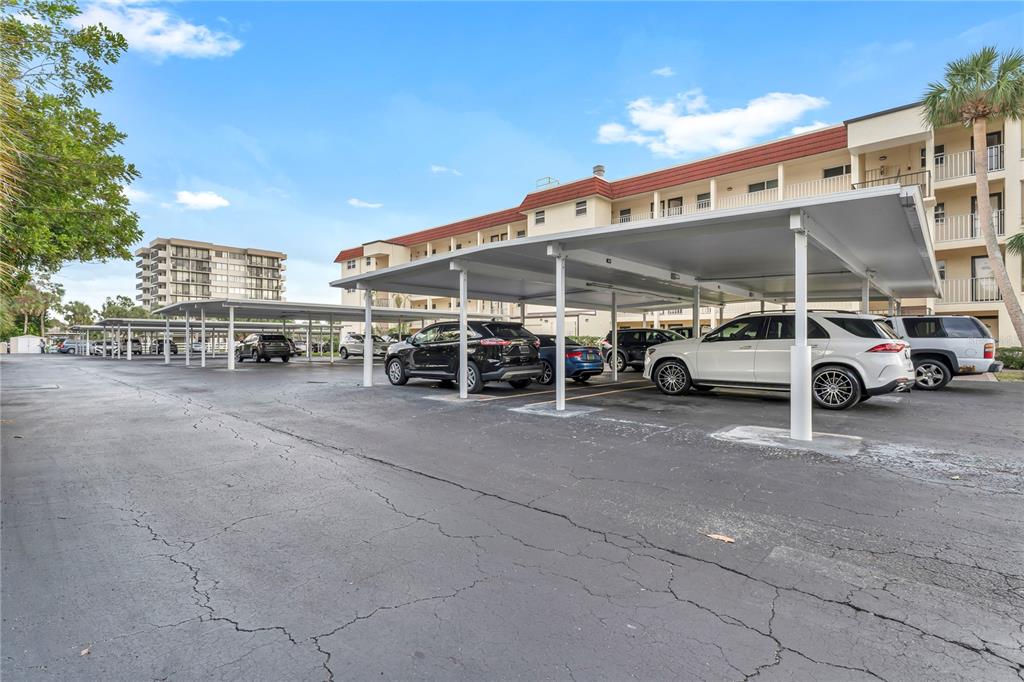 915 Beach Road, Unit 216 Sarasota, FL 34242 - Photo 19 of 30 a car parked in front of a building