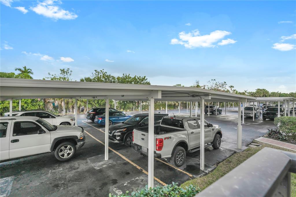 915 Beach Road, Unit 216 Sarasota, FL 34242 - Photo 20 of 30 a view of a car patio with table and chairs