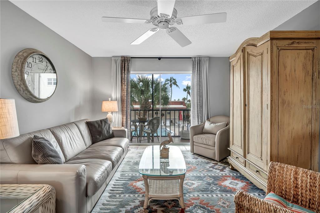 915 Beach Road, Unit 216 Sarasota, FL 34242 - Photo 4 of 30 a living room with furniture and a large window
