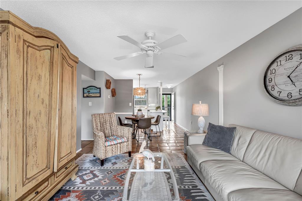 915 Beach Road, Unit 216 Sarasota, FL 34242 - Photo 5 of 30 a living room with furniture and a large window