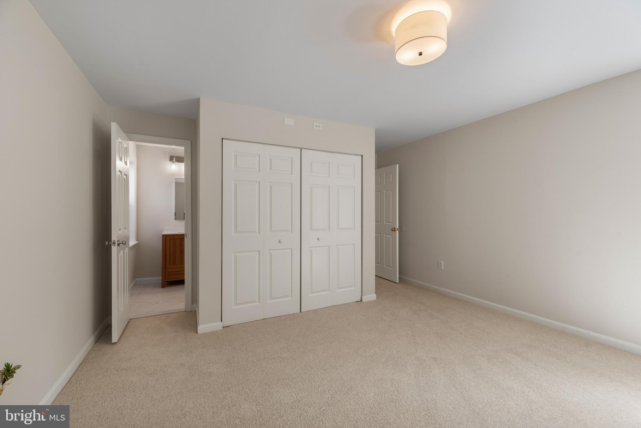 5929 Deale Beach Road Deale, MD 20751 - Photo 23 of 58 Unfurnished bedroom with light carpet and a closet