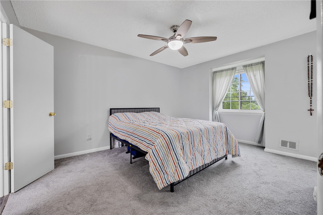 597 French Road Brighton, NY 14618 - Photo 13 of 24 First bedroom is spacious.