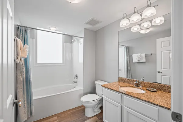 a balcony with furniture and a potted plant