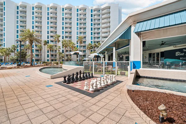 a swimming pool with outdoor seating and yard