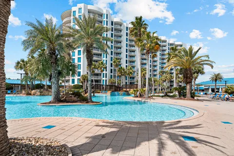 a view of swimming pool with outdoor seating and plants