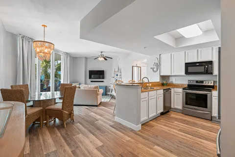 a kitchen with a sink stove and microwave