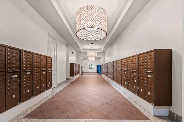 a view of a lobby with furniture and wooden floor