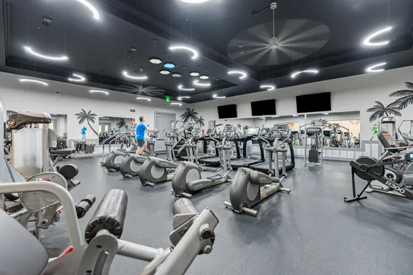 a dining room with furniture a floor to ceiling window and wooden floor