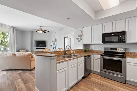 a kitchen with a refrigerator and a sink