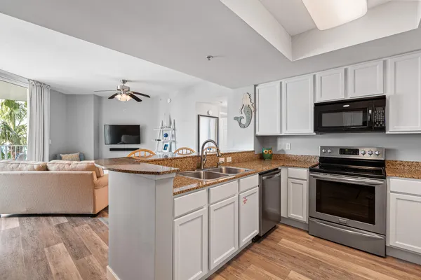 a kitchen with a refrigerator and a sink