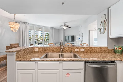 a kitchen with stainless steel appliances a refrigerator stove microwave and cabinets