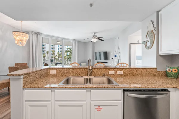 a kitchen with stainless steel appliances a refrigerator stove microwave and cabinets