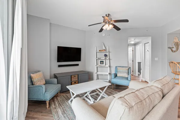 a bedroom with a large bed and a large window