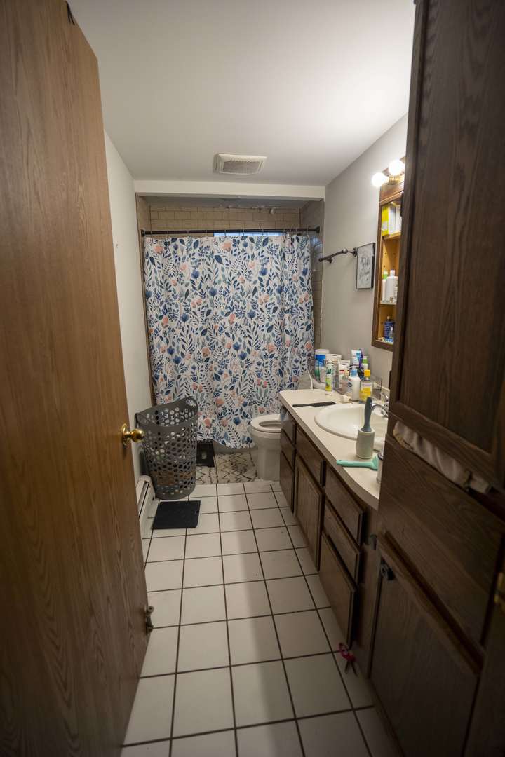 5548 West Cal Sag Road Alsip, IL 60803 - Photo 23 of 42 a kitchen with a sink and a stove top oven