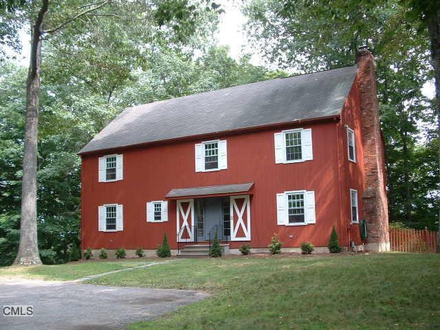64 Bobbys Court Ridgefield, CT 06877 - Photo 1 of 1 a front view of a house with a yard