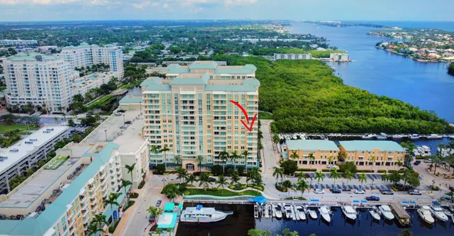 a room with pool table and windows