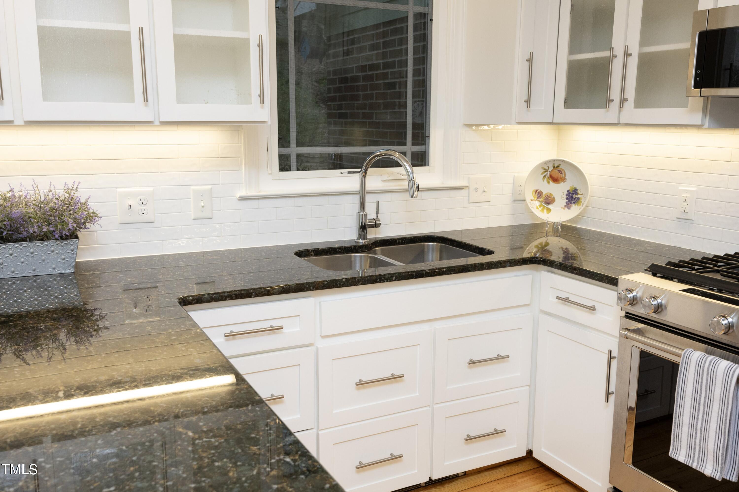 4616 Oak Park Road Raleigh, NC 27612 - Photo 18 of 63 Plenty of countertop space and storage, including pantry