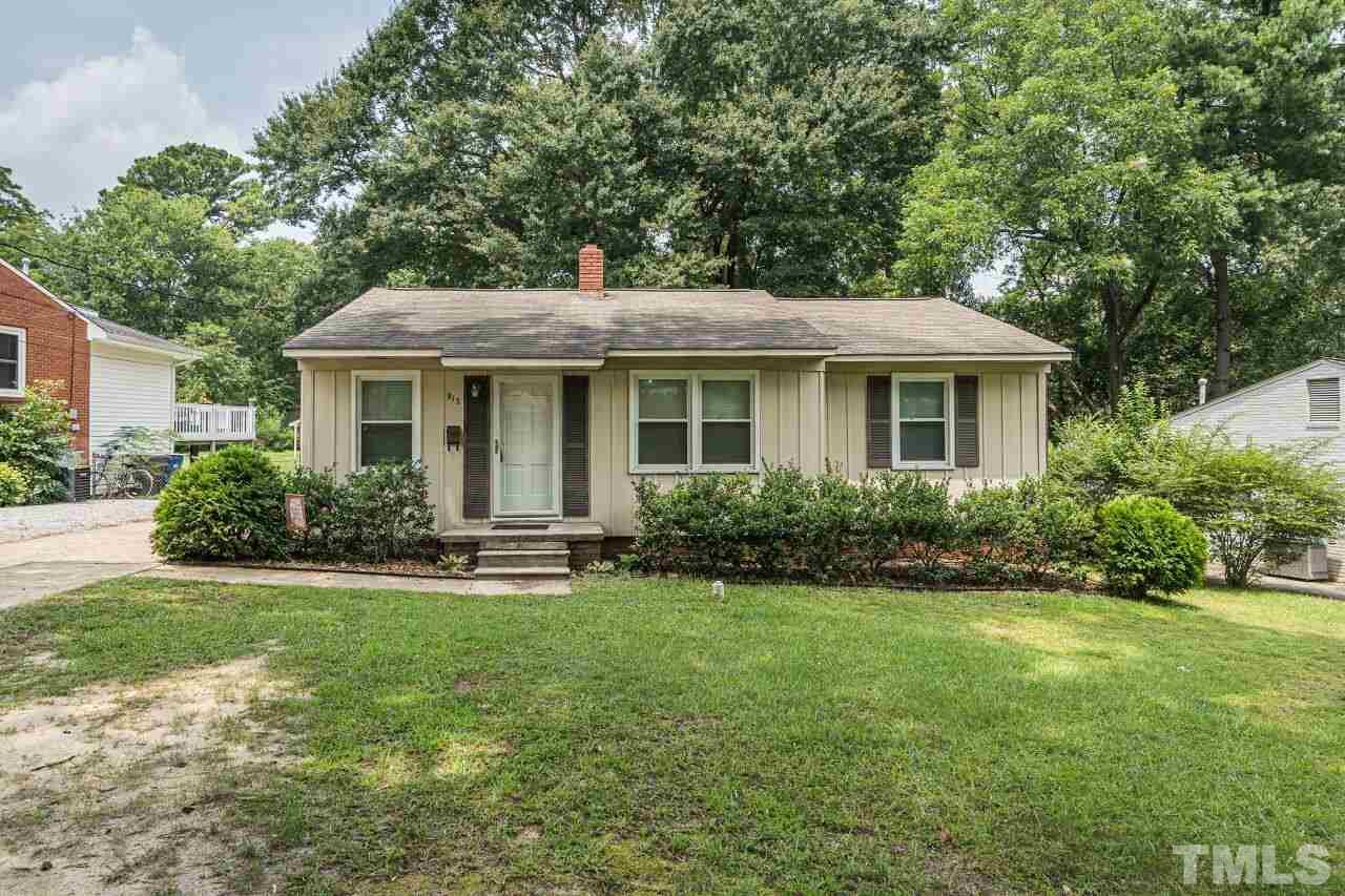 913 Culpepper Lane Raleigh, NC 27610 - Photo 1 of 23 a front view of a house with a yard