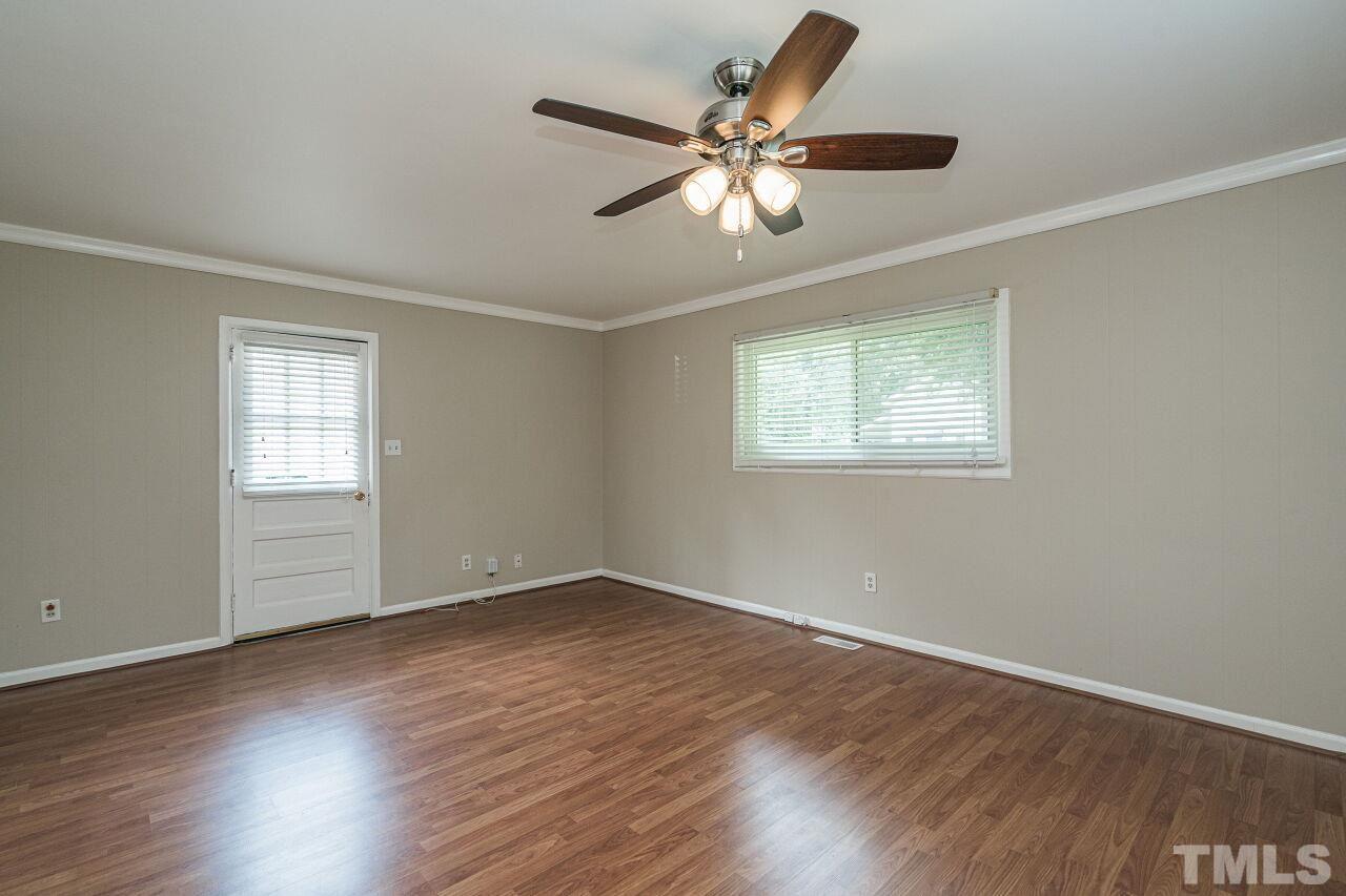 913 Culpepper Lane Raleigh, NC 27610 - Photo 12 of 23 a view of an empty room with wooden floor and a window