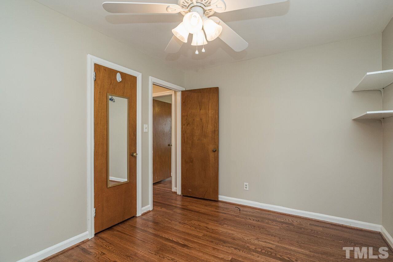 913 Culpepper Lane Raleigh, NC 27610 - Photo 13 of 23 wooden floor in an empty room with a window