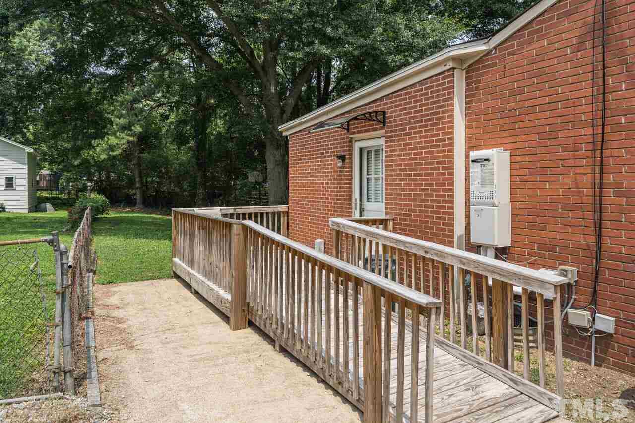 913 Culpepper Lane Raleigh, NC 27610 - Photo 21 of 23 a view of a house with backyard and couches