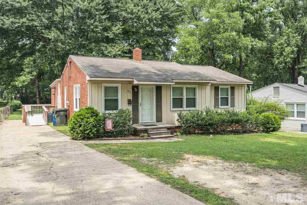 913 Culpepper Lane Raleigh, NC 27610 - Photo 23 of 23 a front view of a house with a yard