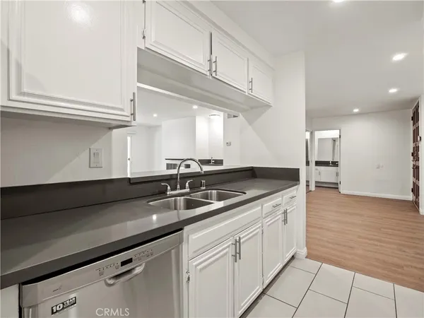 a kitchen with a sink and cabinets