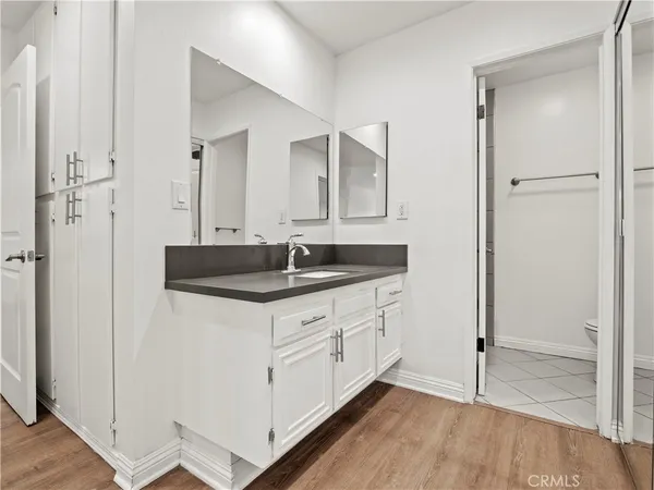 a bathroom with a double vanity sink and mirror