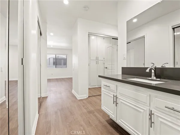 a spacious bathroom with a shower and a sink
