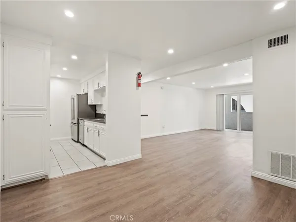 a view of kitchen with furniture and wooden floor