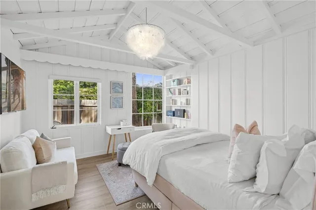 a bedroom with a bed and a couch