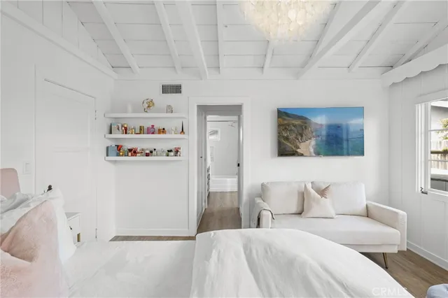 a bathroom with a double vanity sink a mirror and a bathtub