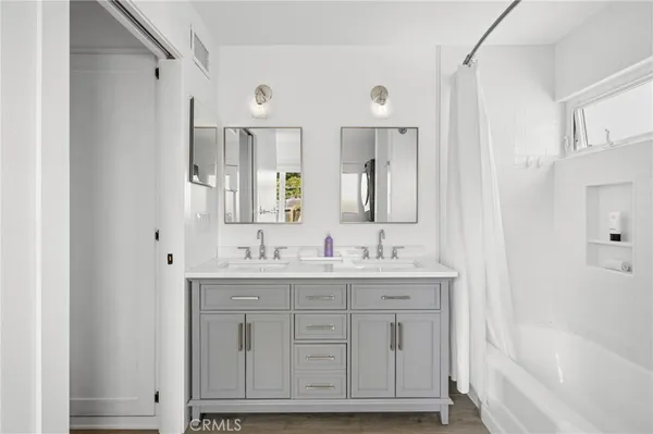 a bathroom with a bathtub and shower